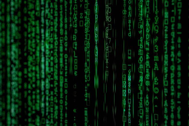 Bright green letters and figures seem to race across a black screen.