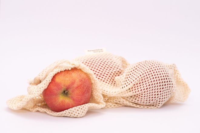Apples in a cloth net bag